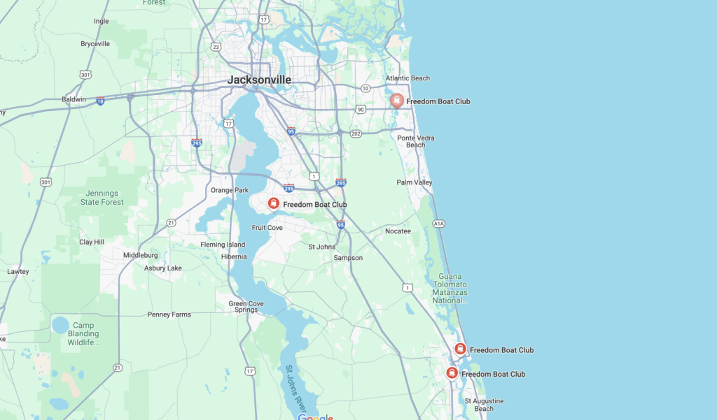 A map of the Jacksonville, Florida area displaying multiple Freedom Boat Club locations marked with red pins along the coast and the St. Johns River. The map highlights key areas, including Jacksonville, Atlantic Beach, Orange Park, and St. Augustine. Nearby landmarks such as the Guana Tolomato Matanzas National Estuarine Research Reserve and Jennings State Forest are visible. Major highways, including I-295, I-95, and U.S. Route 17, are shown for reference. The map provides a clear overview of the region and the location of boat club facilities for boating enthusiasts.